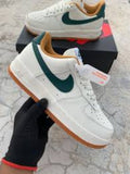 Air Force 1 Low sneakers feature a dark green swoosh