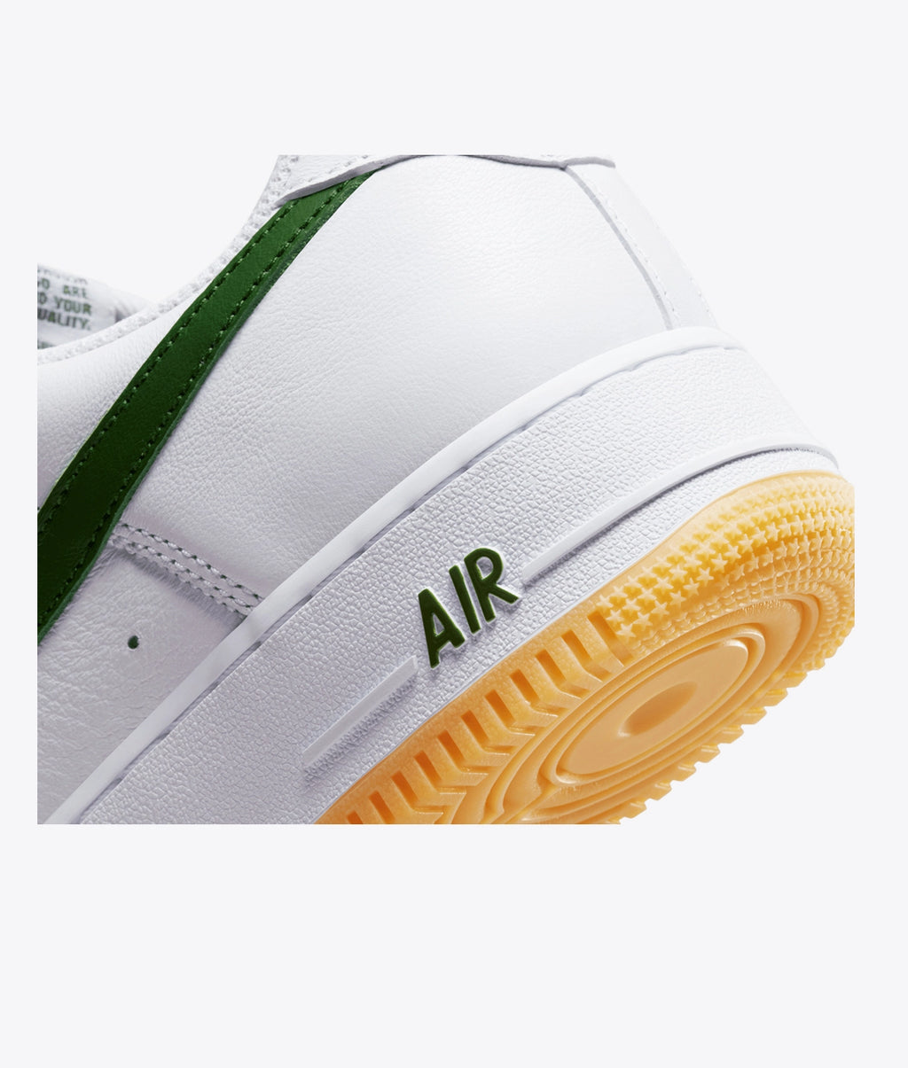 Air Force 1 Low sneakers feature a dark green swoosh