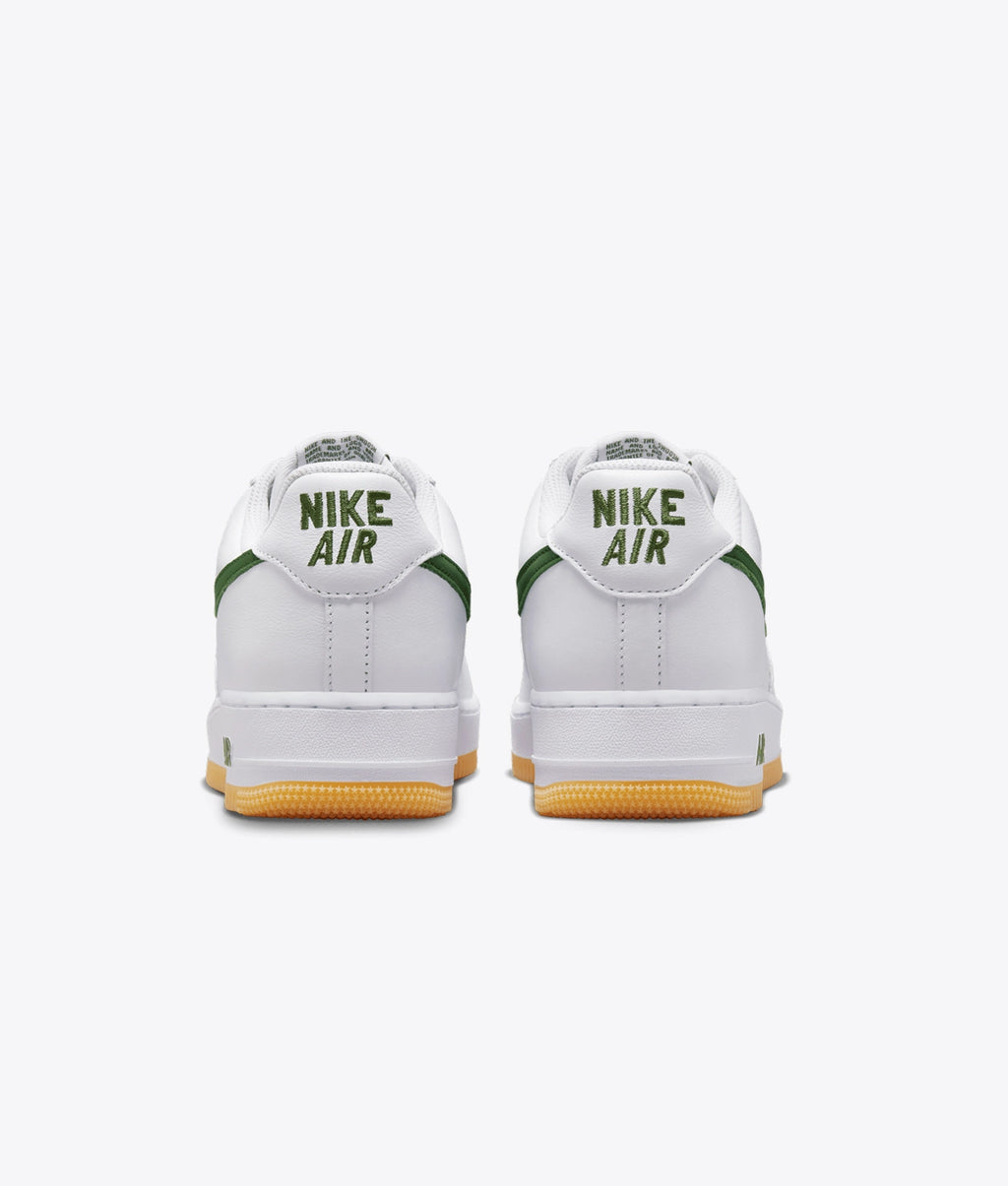 Air Force 1 Low sneakers feature a dark green swoosh