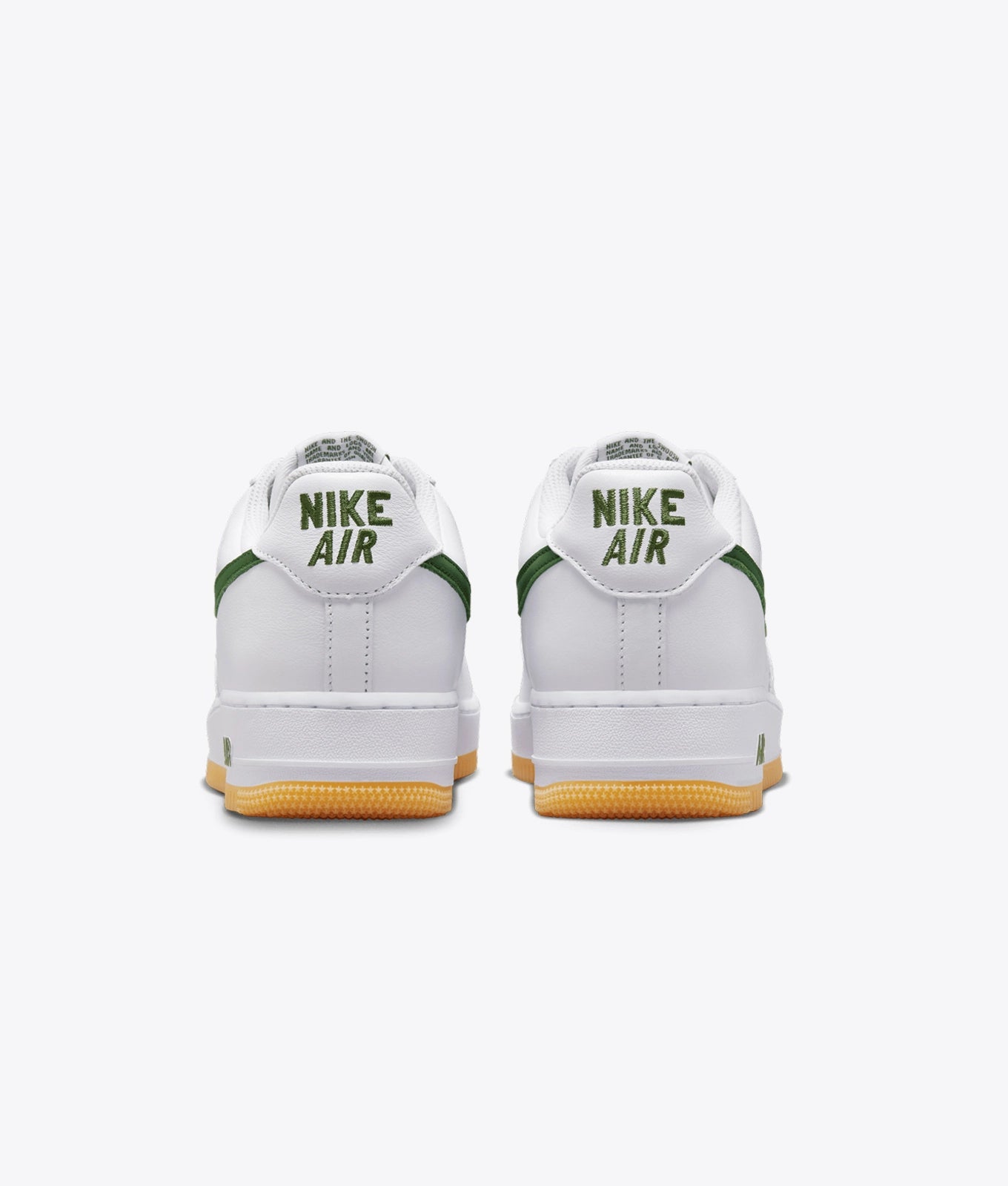 Air Force 1 Low sneakers feature a dark green swoosh