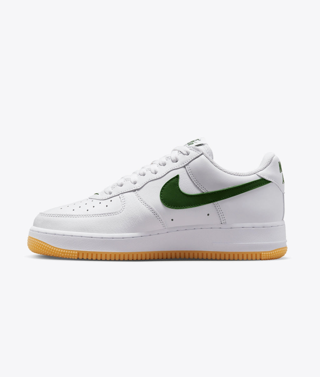 Air Force 1 Low sneakers feature a dark green swoosh